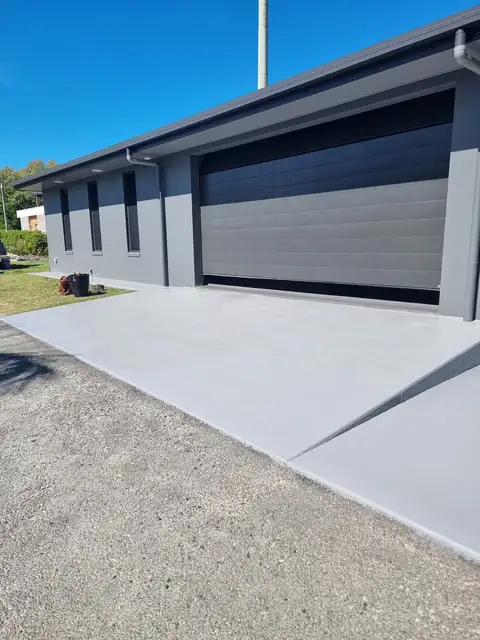 Grey driveway up to the garage