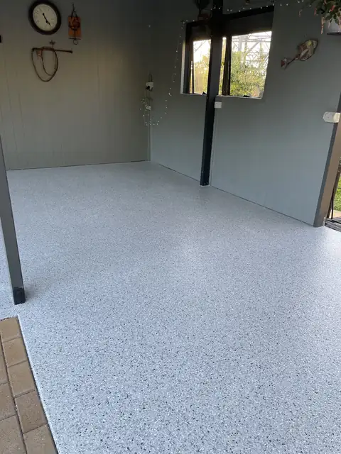 A garage floor finished in flake epoxy