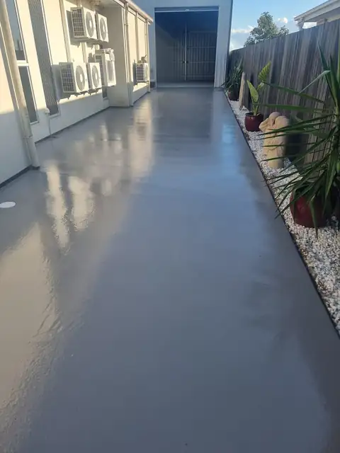 A long side path sealed in smooth grey, still glossy